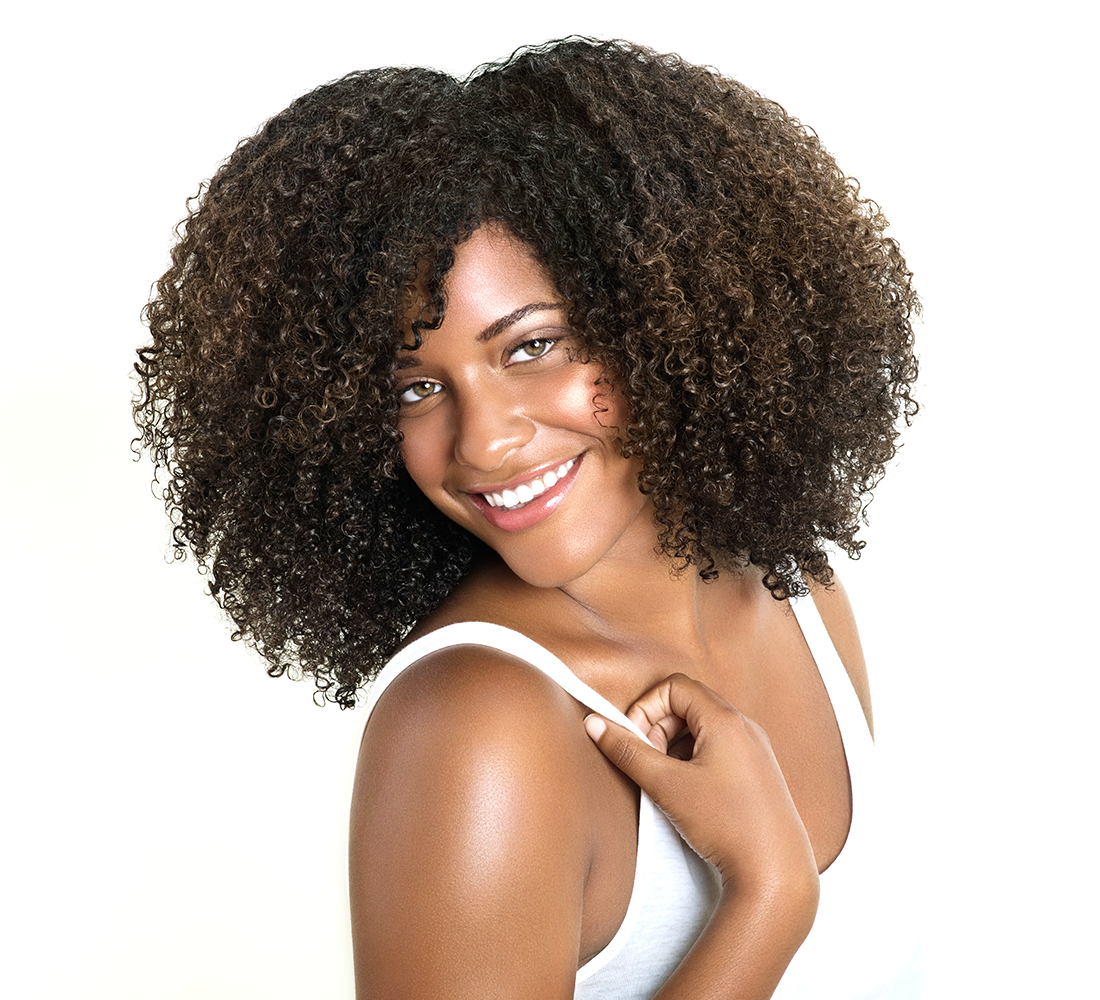 Woman with short black curly hair wearing a white top