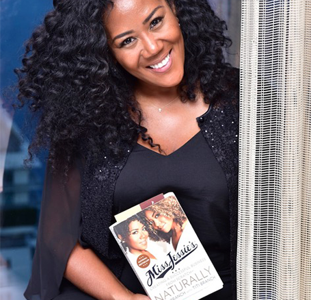 Woman holding a Miss Jessie's book